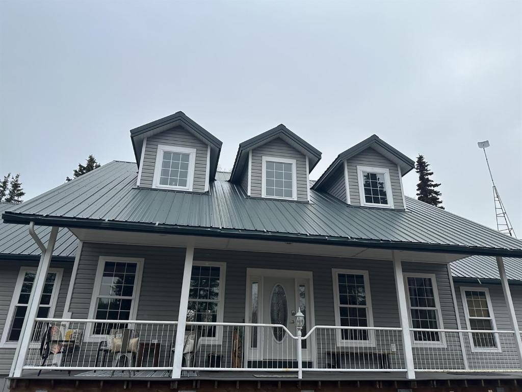 a house with a metal roof at Constellation Lake Home in Kasilof