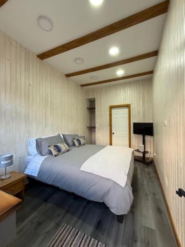 a bedroom with a large bed in a room at alojamiento Santa Rosa 744 in Puerto Varas