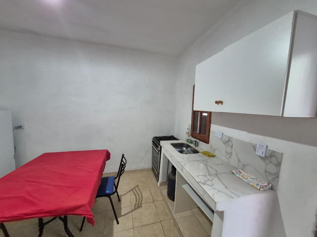 a room with a kitchen with a counter and a table at Parque de la Juventud in La Rioja