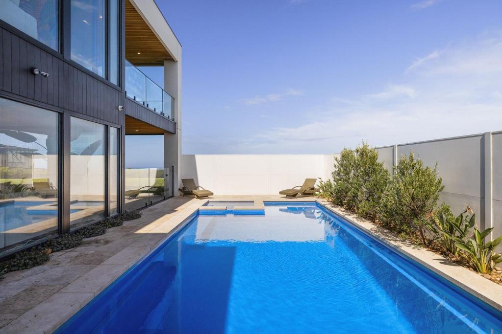 an image of a swimming pool in a house at Island View San Remo in San Remo