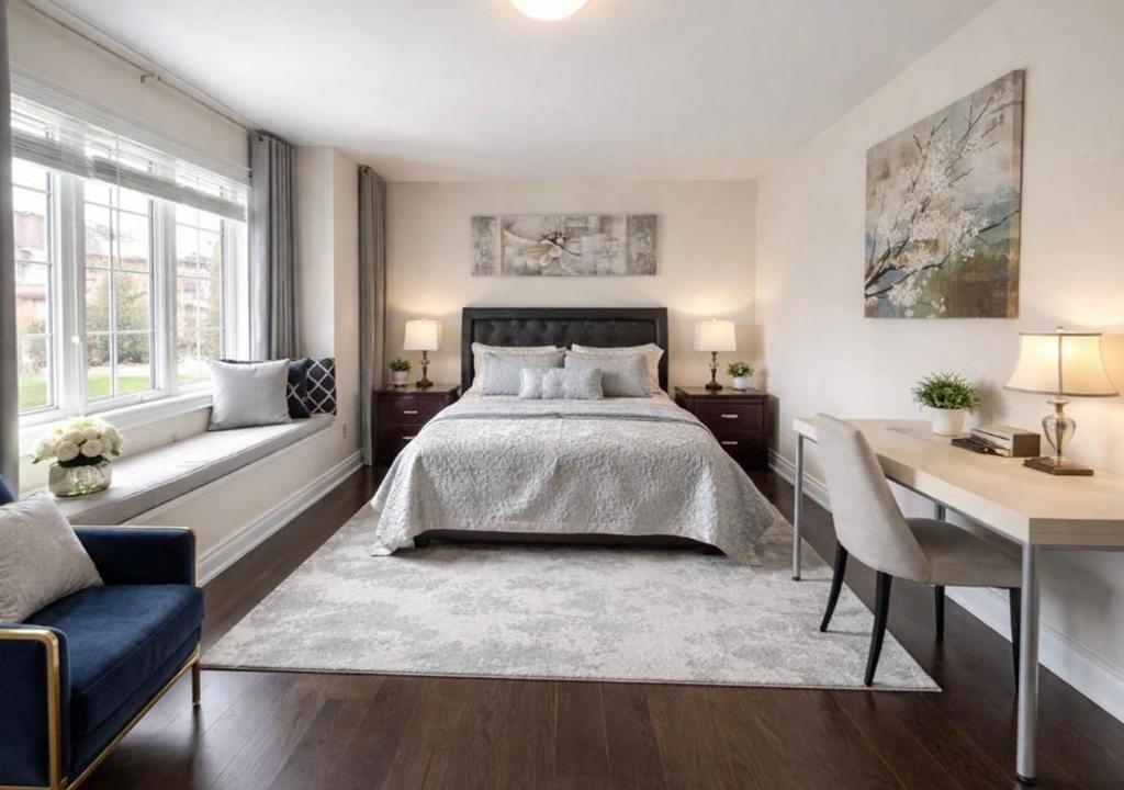 a bedroom with a bed and a desk and windows at Quite Cozy Private Room In Vaughan with Private Bathroom and Free Parking in Vaughan