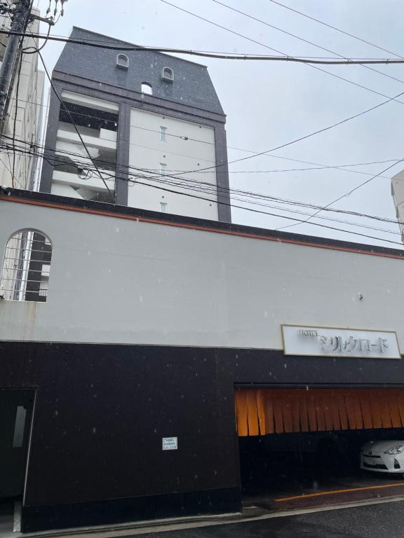 a black and white building with a window at ピンポンホテル Peace Park in Hiroshima