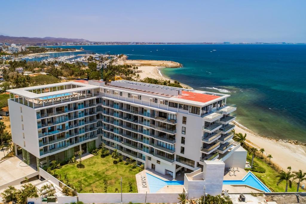 an aerial view of a building on the beach at Oceanfront Gem with Bay View Terrace & Direct Sea Access in Cruz de Huanacaxtle
