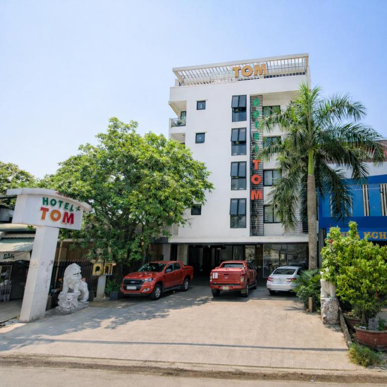 a hotel room with cars parked in a parking lot at Tom Hotel Huế near Phu Bai Airport in Hue