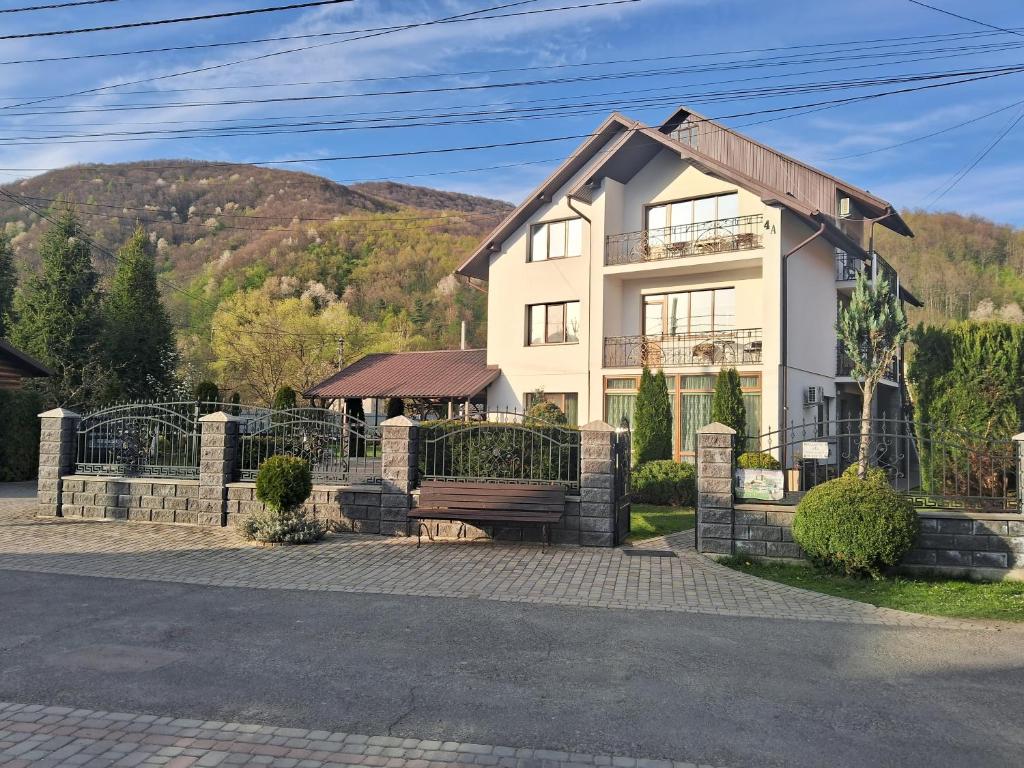 a house with a bench in front of it at Maria in Solochyn