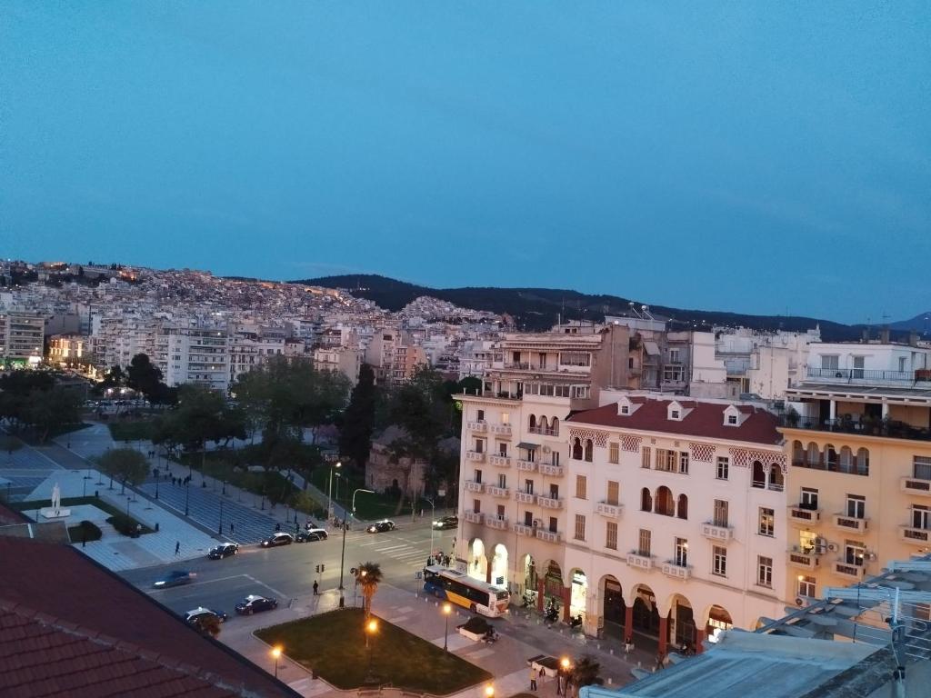 a view of a city at night at 7th sky Aristotelous in Thessaloniki