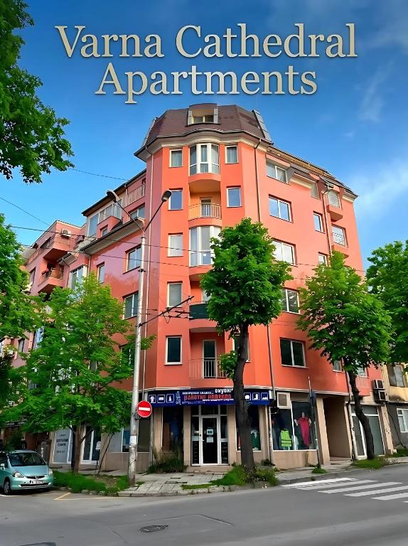 an orange building on the corner of a street at Varna Cathedral Apartments in Varna City