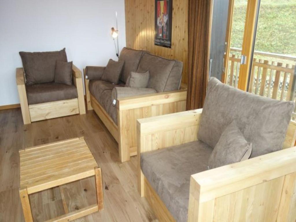a living room with couches and a couch and a chair at Apartment in Veysonnaz near Ski Gondola in Veysonnaz