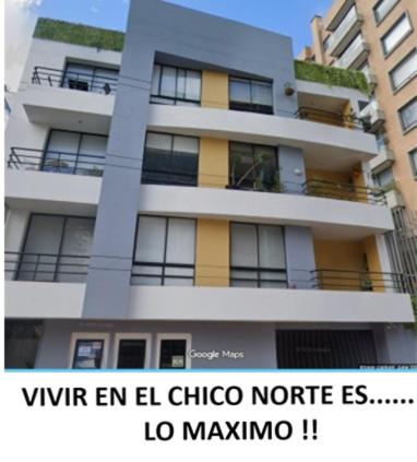 a tall building with a sign that reads viven rein el chico note fs at Ultimate Whole Floor Apartment in Bogotá
