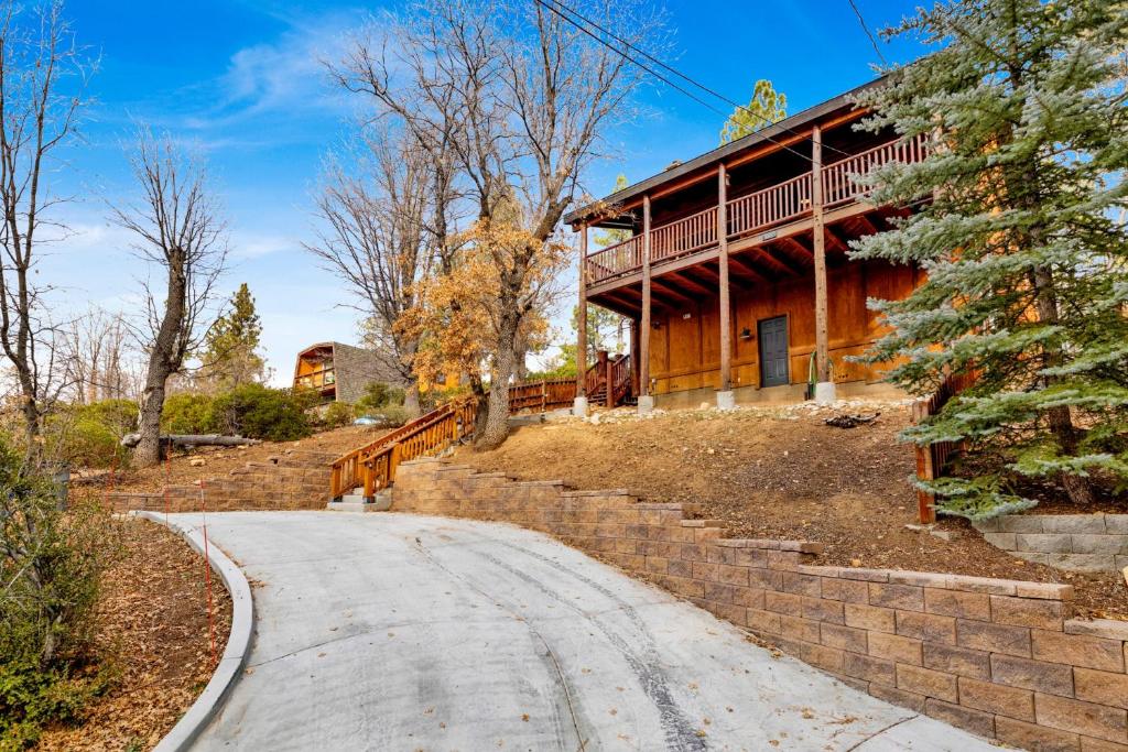 a house on a hill with a road in front of it at 2614 - Cielos Nest in Big Bear Lake