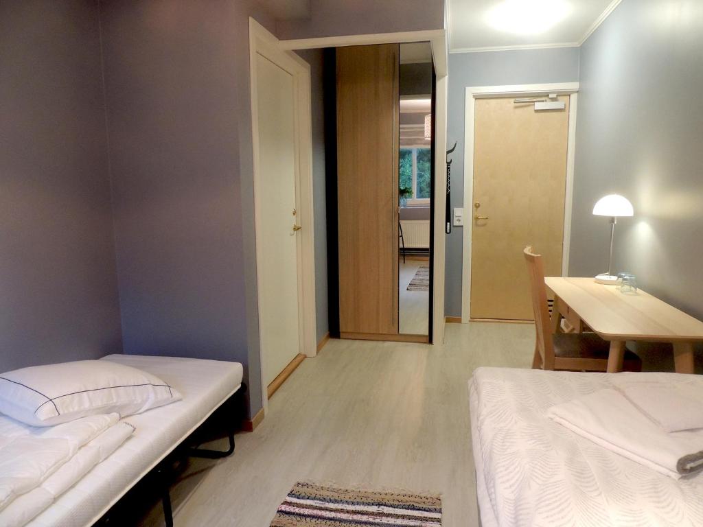 Postel nebo postele na pokoji v ubytování Hotell Munkeröd