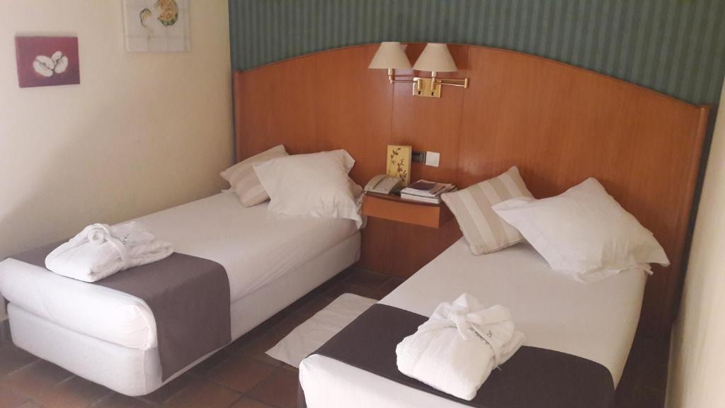 Postel nebo postele na pokoji v ubytování Hotel L'Estació