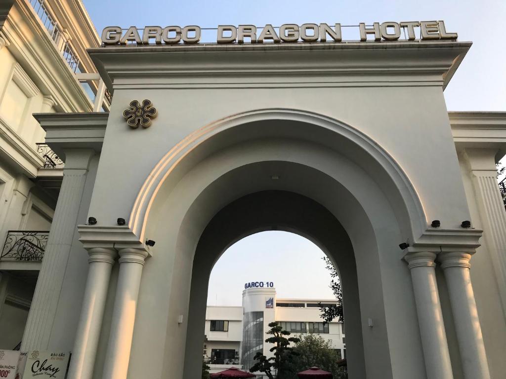 an entrance to a barozonazona hotel with an arch at Garco Dragon Hotel in Hanoi