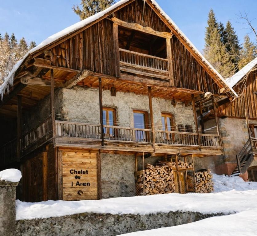 a log cabin in the snow at Authentic chalet in Saint-Jean-dʼArves