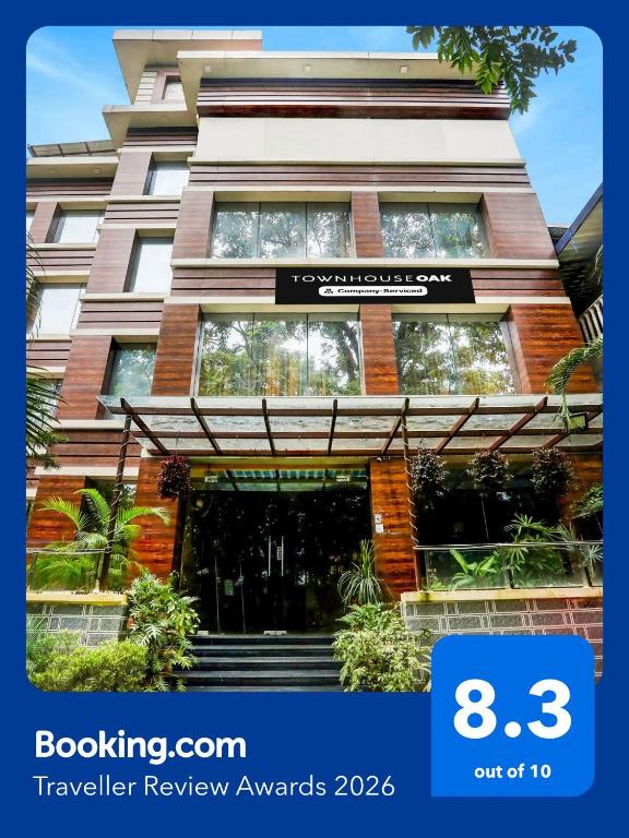 a building with a sign that reads traveler review awards at Townhouse Oak Pacify Hills in Dehradun
