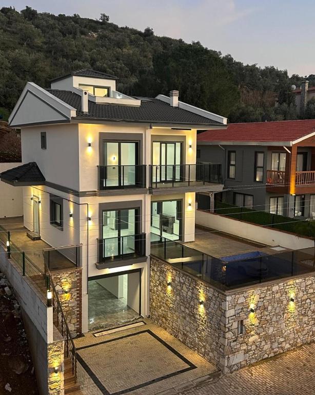 a large house with lights on top of it at Villa Gaia in Selçuk