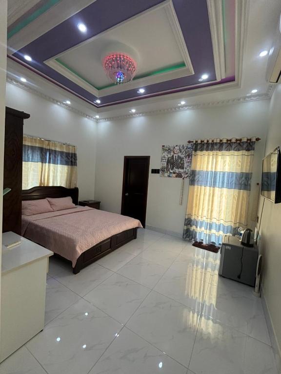 a bedroom with a bed and a ceiling at Beachside home 2 in Phú Quốc