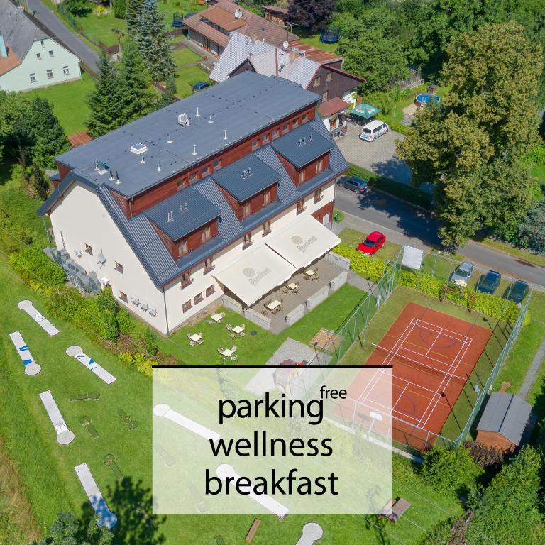 a house with a sign that reads parking free wellness breakfast at Hotel Toč in Lipova Lazne