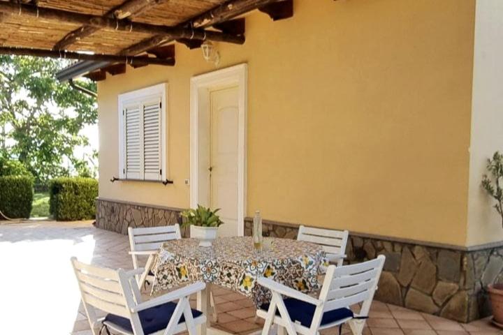 a table and chairs sitting on a patio at Casa Vinaccia in Massa Lubrense