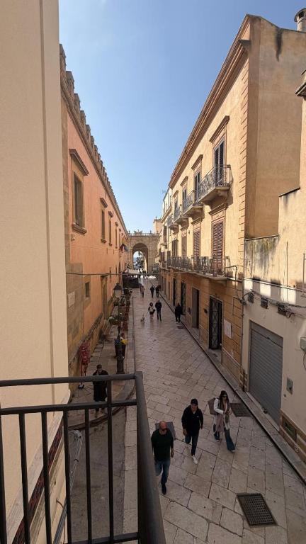 a group of people walking down a street at Le Cupole in Marsala