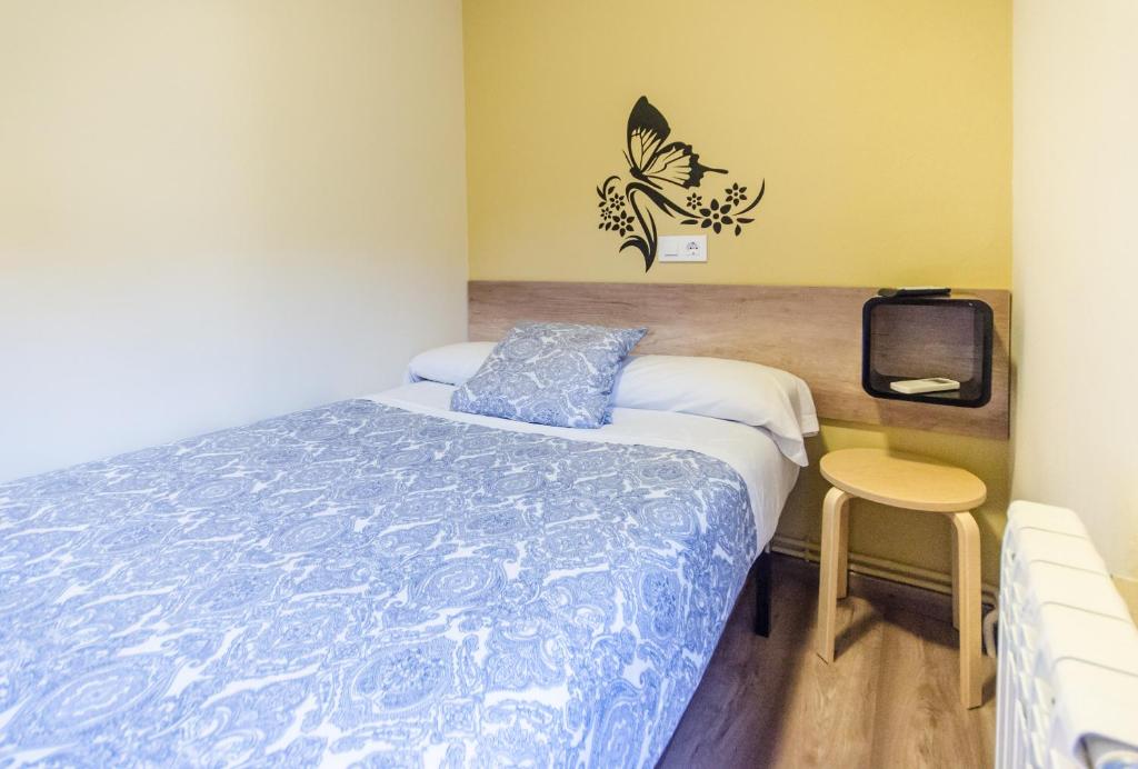 Posteľ alebo postele v izbe v ubytovaní Hostal La Pastora