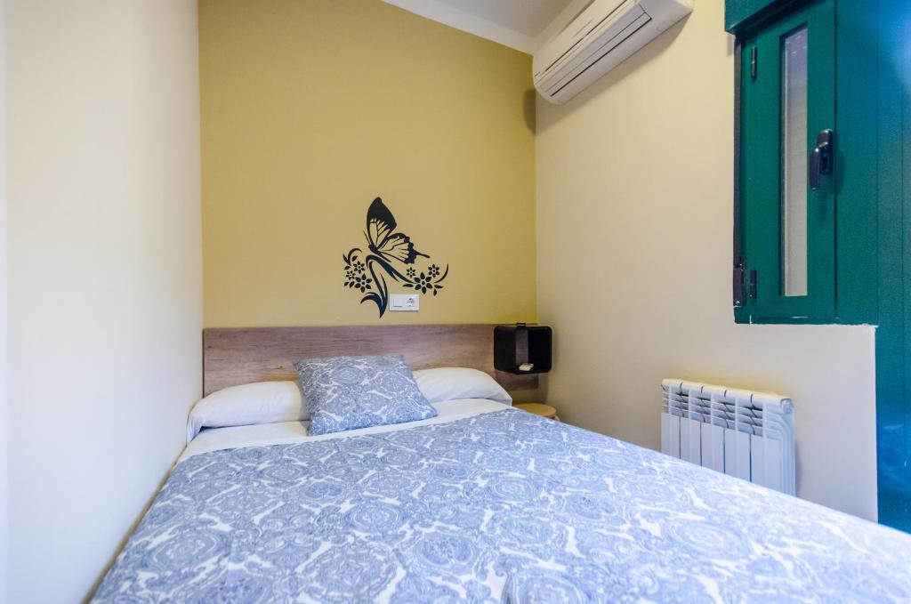 Posteľ alebo postele v izbe v ubytovaní Hostal La Pastora