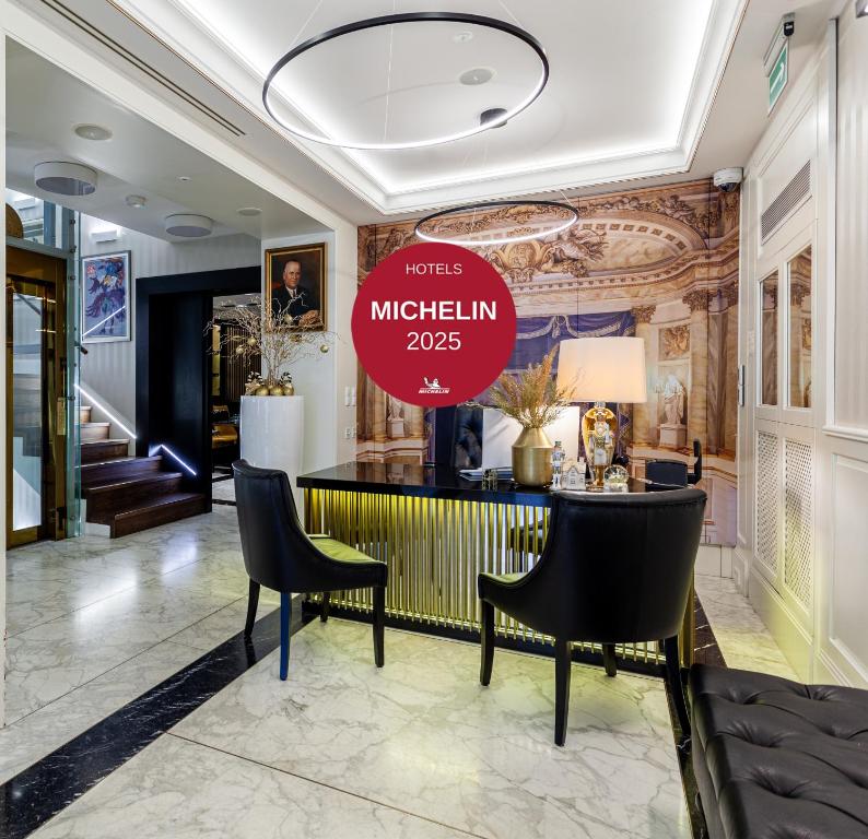 a lobby with a sign that reads mitzlin at Hotel Teatro Boutique Old Town - Destigo Hotels in Warsaw