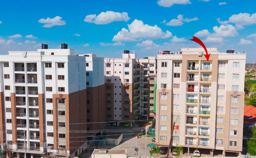 a building with a kite on top of it at 4 Bedroom Apartment Near JKIA & SGR in Nairobi