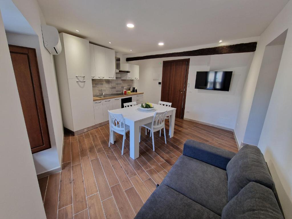a living room with a white table and a couch at Dimore Rosantò 2 in Palombaro