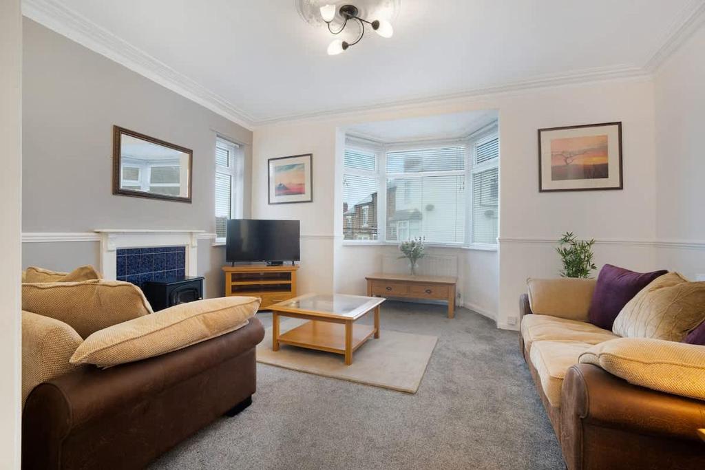 a living room with two couches and a tv at NEW! 3BR in Haughton Road in Darlington