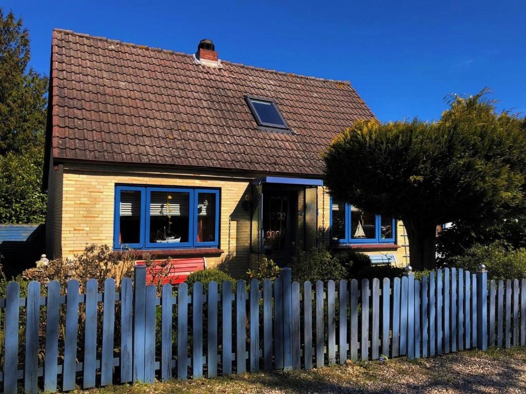 a small house with a fence in front of it at Ferienhaus Deubel Escobar in Kappeln