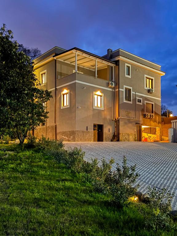 a large house with a lot of windows at Dimora Alfinito in Salerno