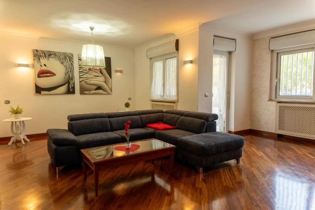 a living room with a couch and a table at La Mia Reggia B&B in San Nicola La Strada