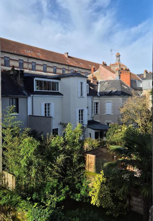 a group of buildings in a city with trees at Villa Sévigné in Nantes