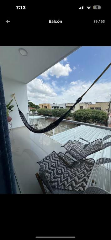 a view through a window of a room with chairs at Bien ubicado 3 -habitaciones 3- Aires in Montería