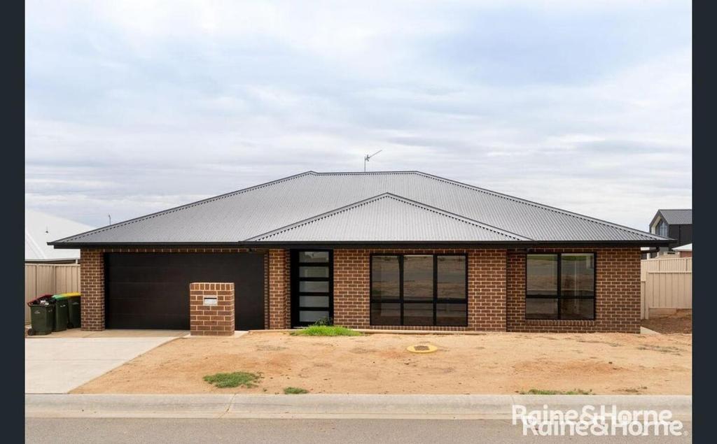a brick house with a black roof at Wyoming Ave in North Wagga