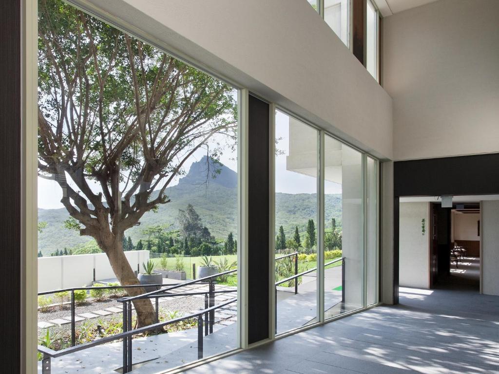 a house with a view of a tree at Gloria Manor in Kenting