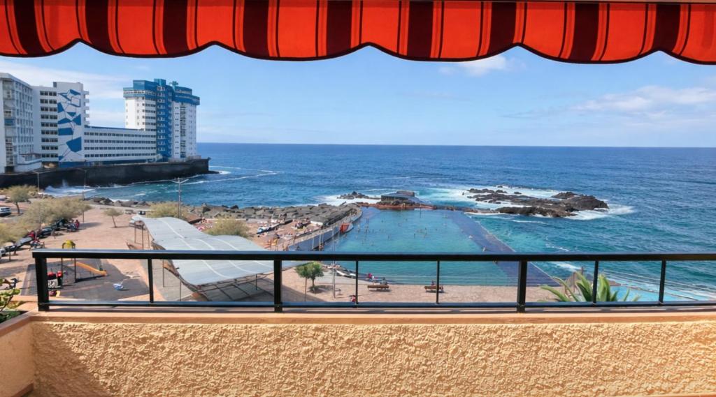 a view of the ocean from a balcony at Terraza con vistas al mar Tenerife Norte Mesa del Mar in Tacoronte