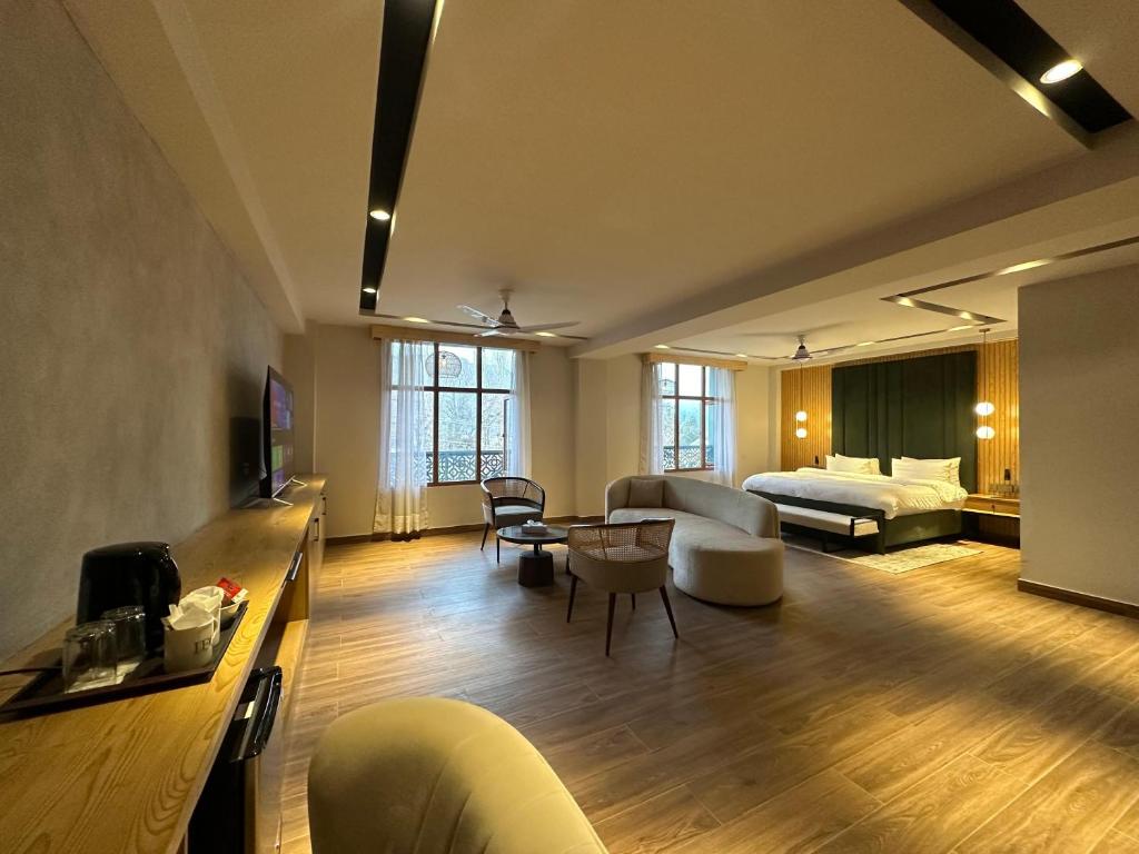 a large living room with a couch and a table at IFQ Premier Skardu in Skardu