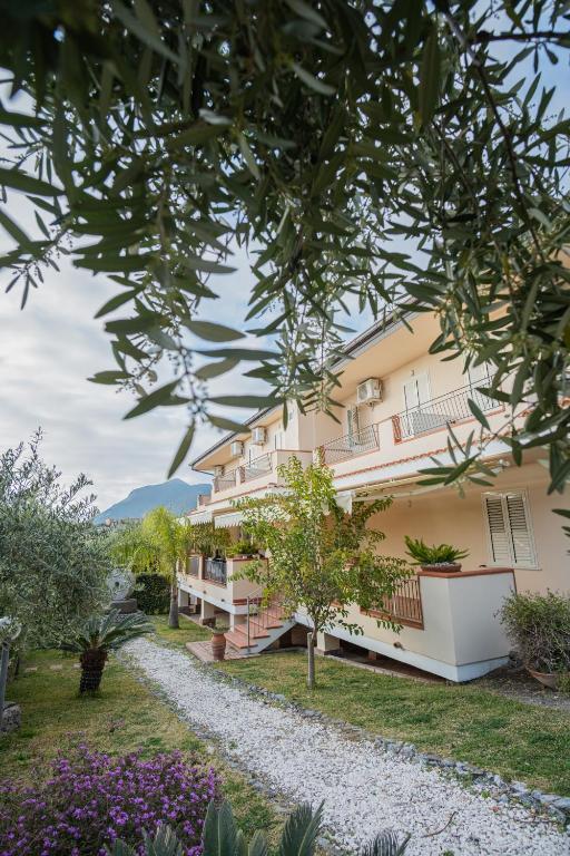 a building with a pathway in front of it at Ravè in Praia a Mare