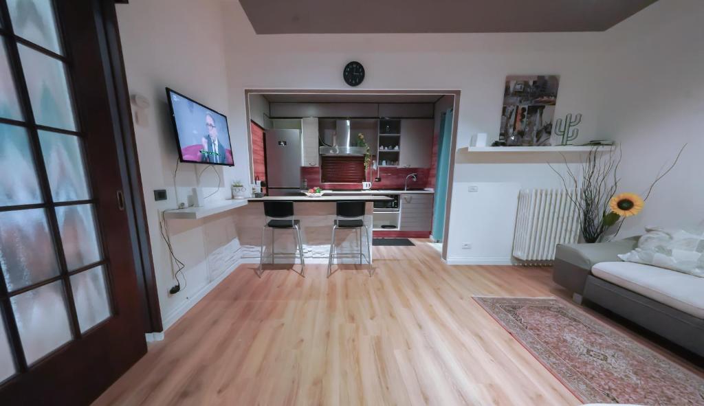 a living room with a table and a couch at The Ngatchou in Mestre