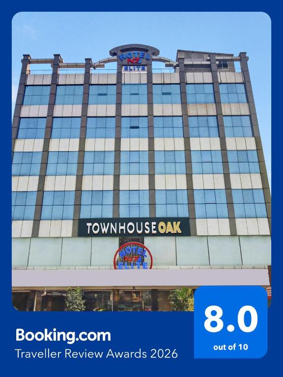 a tall building with a sign on it at Super Townhouse Oak LB Nagar Ramoji in Hyderabad