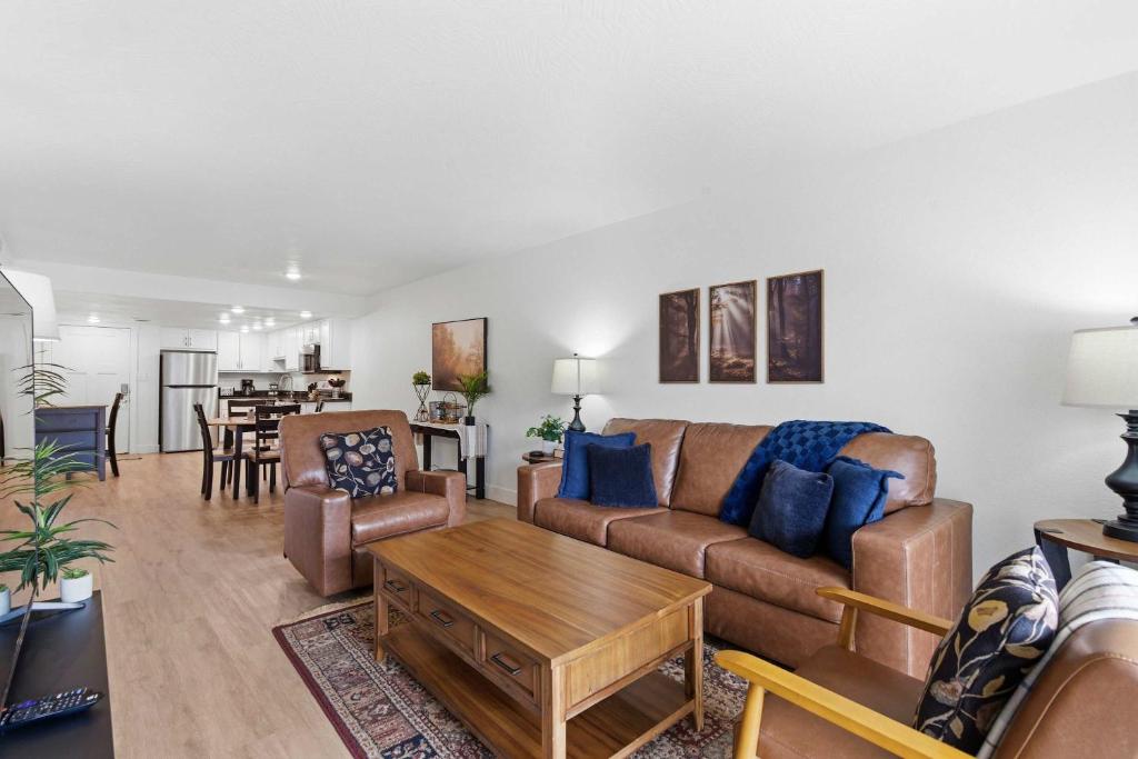 a living room with a couch and a table at Serene Creek Condo Pool & Gym in Branson