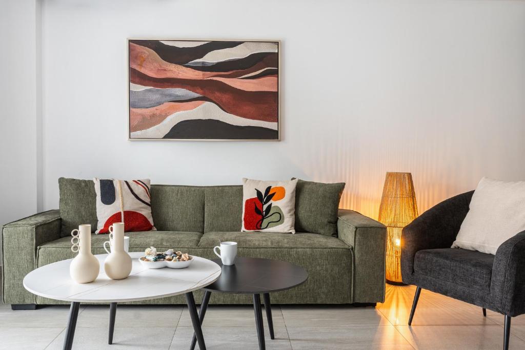 a living room with a couch and a table at Kraken 2-BR Apartment by Makenzy Beach in Larnaca