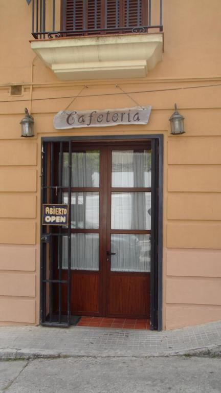 a door to a building with a sign on it at Hotel Posada Casas Viejas in Benalup Casas Viejas