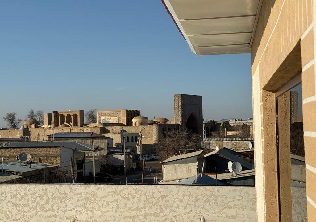 a view of a city from a building at Amir Mumtoz Hotel in Bukhara