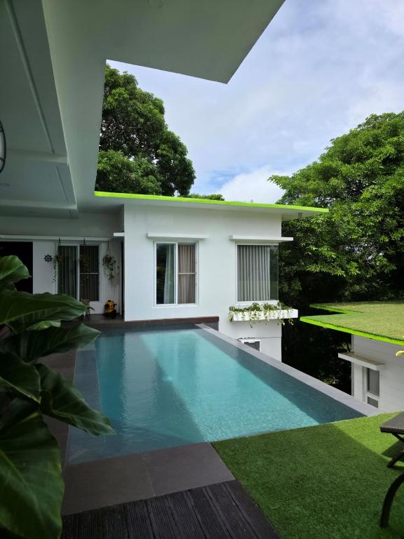 a swimming pool in the backyard of a house at Amazing Villa Best View in Boracay
