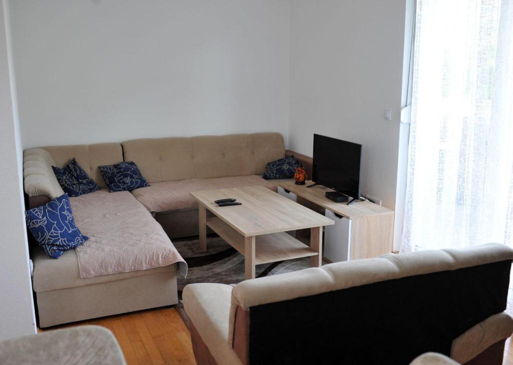 a living room with a couch and a table at Vikendica Danilo in Banja Luka