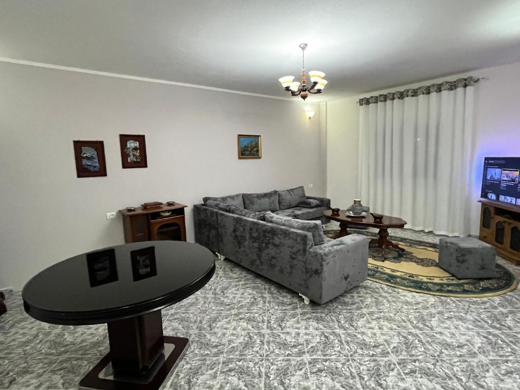 a living room with a couch and a table at Villa Cozy in Laknas