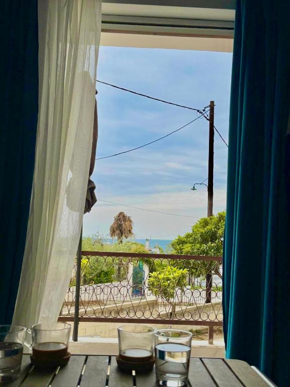 a room with a table with a view of the ocean at Sea View Chic Apartment in Karianí
